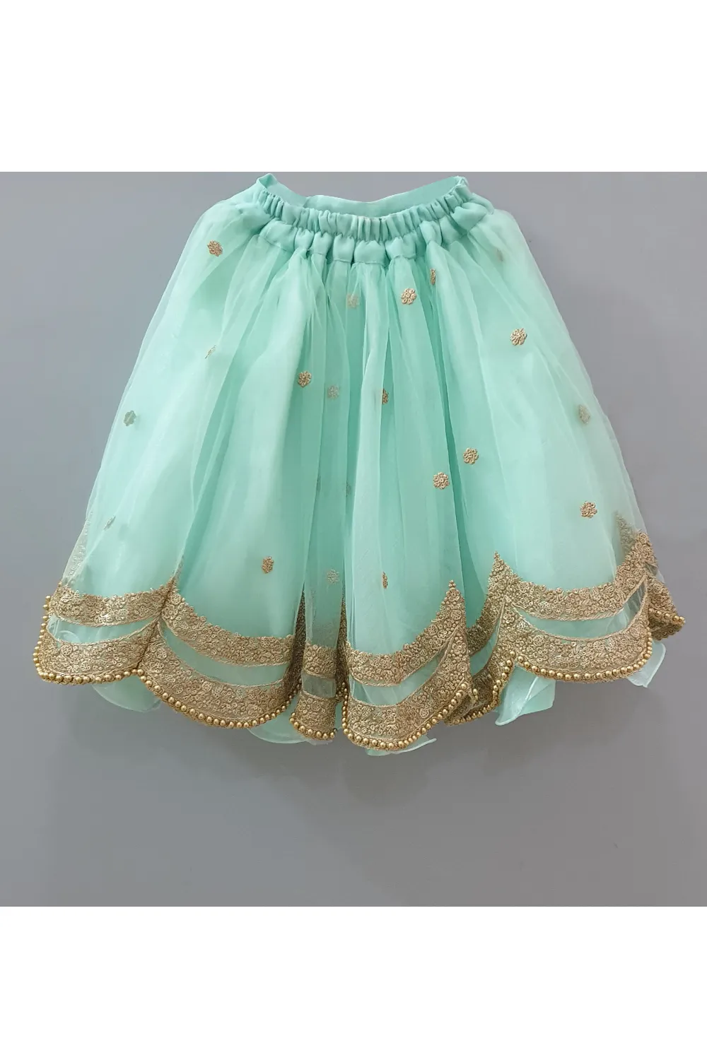 Bottle green choli with attached dupatta and aqua green lehenga