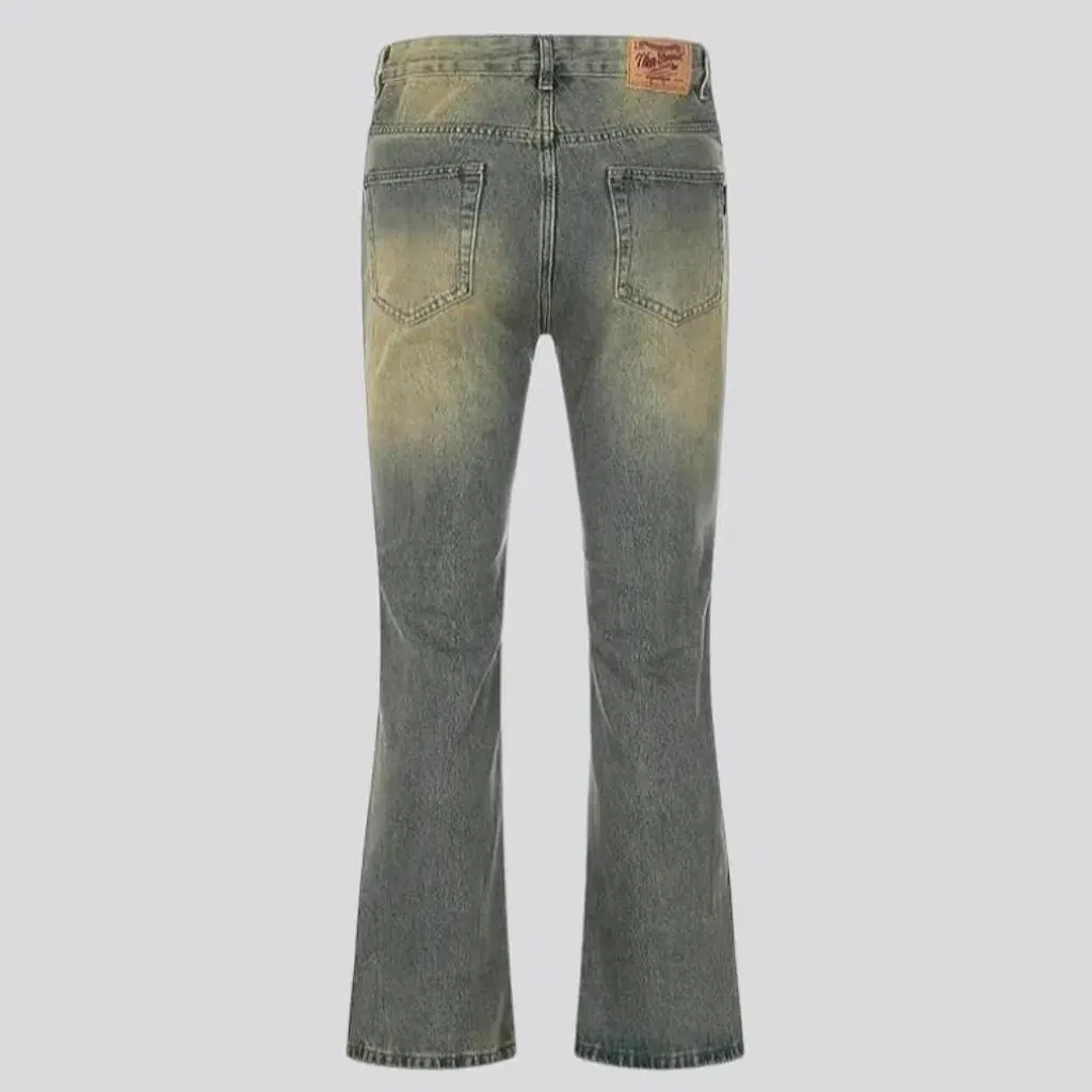 Medium-wash whiskered jeans
 for men