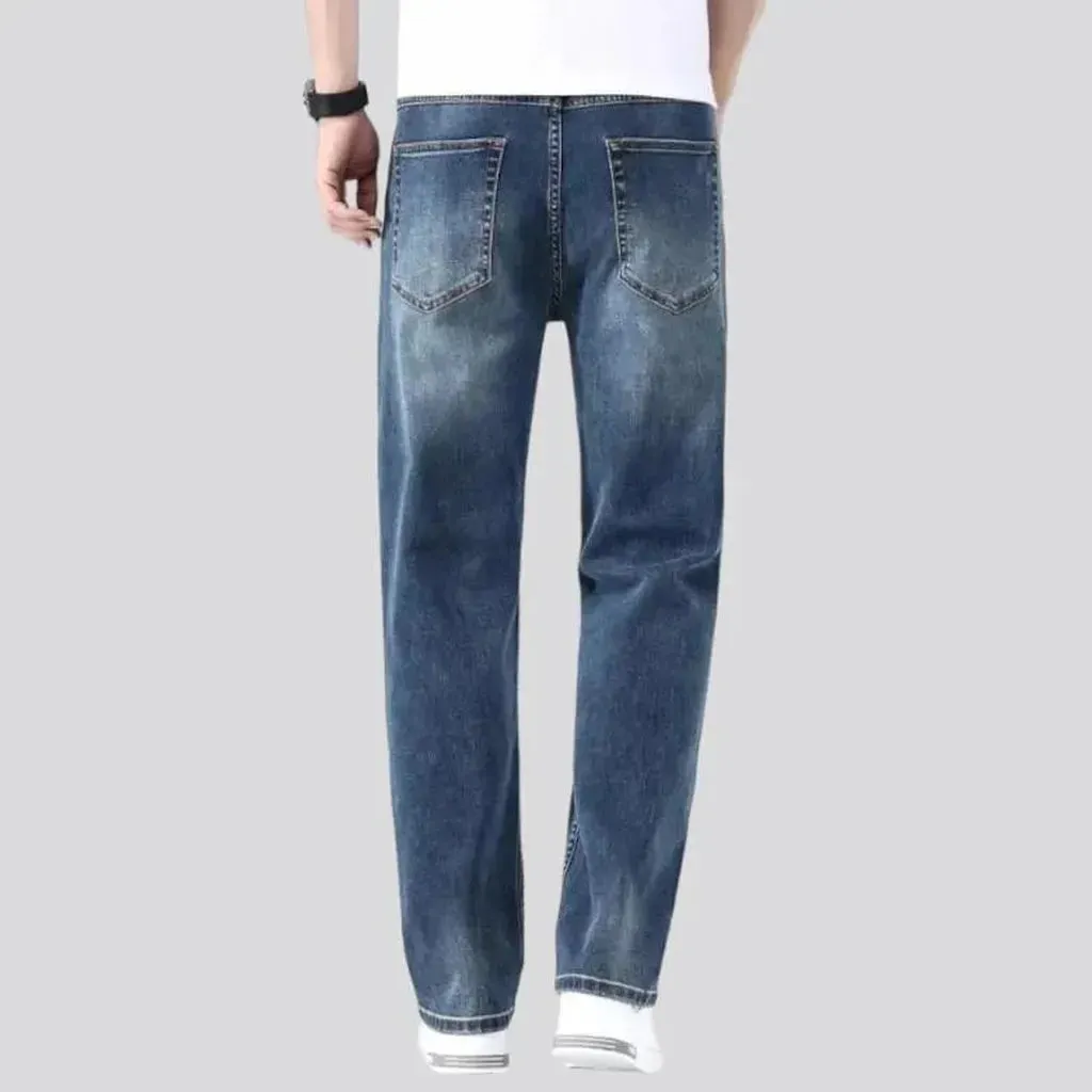 Stonewashed whiskered jeans
 for men