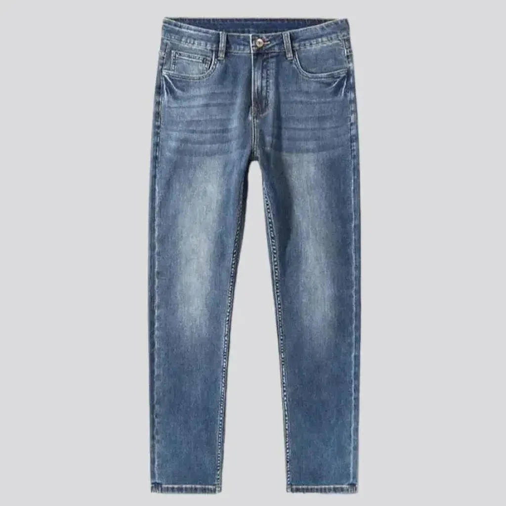 Stonewashed whiskered jeans
 for men